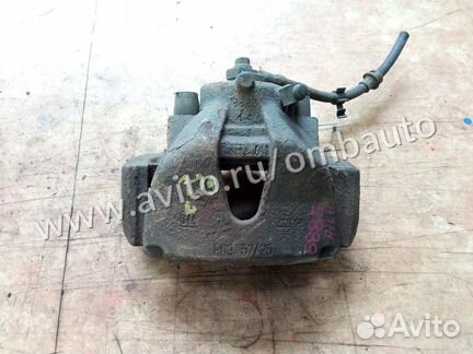 Суппорт тормозной передний левый Опель Зафира Б